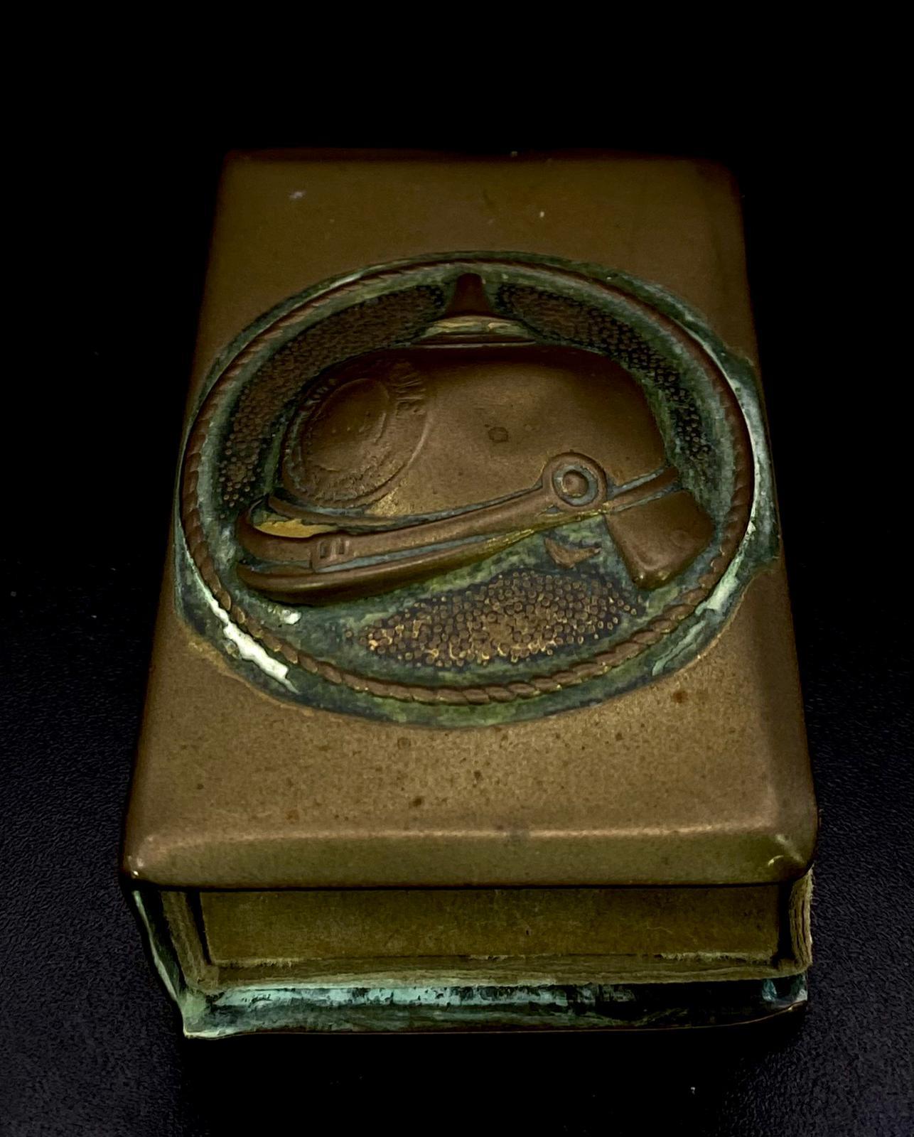 A Vintage Brass Trench Art Matchbox/Vesta Holder with Raised Relief of a German 'Pickelhaube'