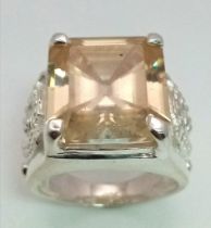 A Heavenly 19.60ct Champagne Moissanite Ring set in 925 Silver. Rectangular-cut gemstone. Comes with
