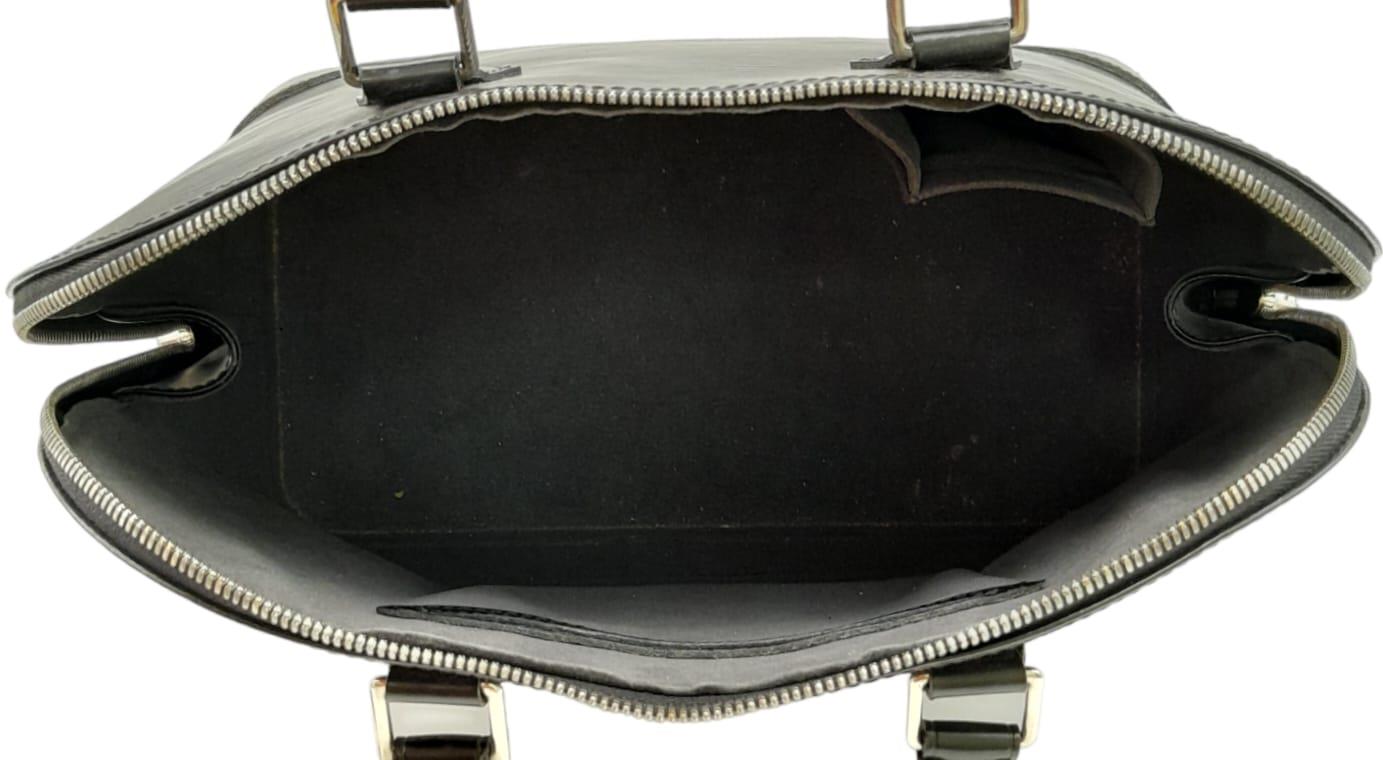 A Louis Vuitton Black 'Alma' Bag. Epi leather exterior with rolled handles, and silver-tone - Image 5 of 10