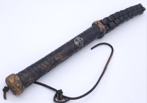WW2 German Bull Whip Handle with a badge of the Ordnungspolizei embedded into the handle. Maybe