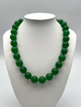 A Large Bead Green Jade Necklace with Lifesaver Clasp. Beads - 14mm. Necklace length - 44mm.