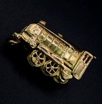 A Vintage 9K Yellow Gold Train Pendant/Charm. 2cm. 4.56g weight.