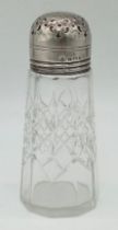 An Antique Sterling Silver and Cut Glass Sugar Caster. Hallmarks for Birmingham 1910. 13cm tall.