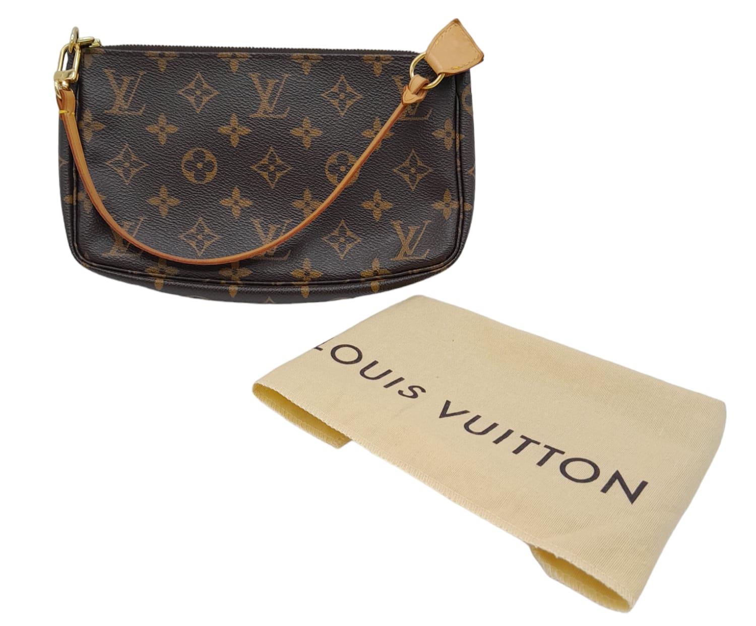 This Louis Vuitton Pochette features the classic mongogram canvas design, engraved gold tone