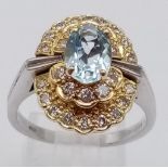 18k 2 colour diamond and aquamarine dress ring. Weight: 7.4g Size Q (dia:0.84ct/aqua:1.10ct)