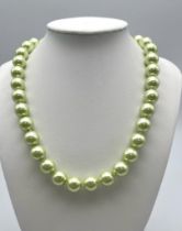 A Metallic Lime-Green South Sea Pearl Shell Large Bead Necklace. 12mm beads. Glitterball clasp. 44cm