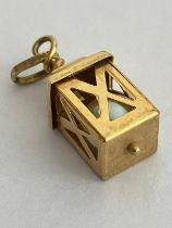 9 carat GOLD LANTERN CHARM. Fully hallmarked and having a pearl encased in the lantern. 1.14 grams.