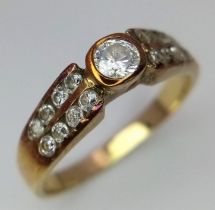 A vintage, 9 K yellow gold ring with clear round cut stones, ring size: O, weight: 2.8 g.