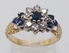 AN 18K YELLOW GOLD DIAMOND & SAPPHIRE CLUSTER RING. Size I, 0.20ctw diamonds, 3.5g total weight.