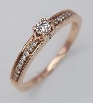9k rose gold diamond solitaire with diamond set shoulders ring Weight: 2.1g Size P (dia:0.20ct)