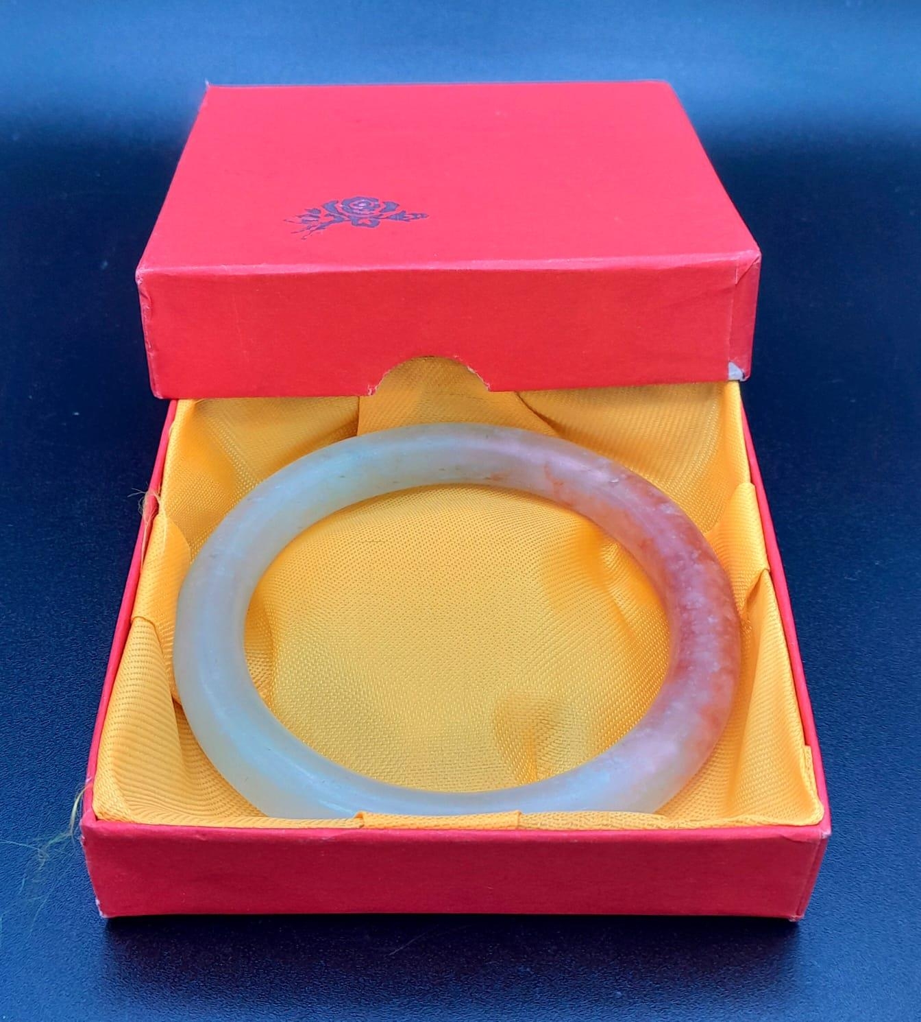 Boxed Jade bangle. Beautiful powdered green with red highlights. 8cms in diameter. - Image 4 of 4