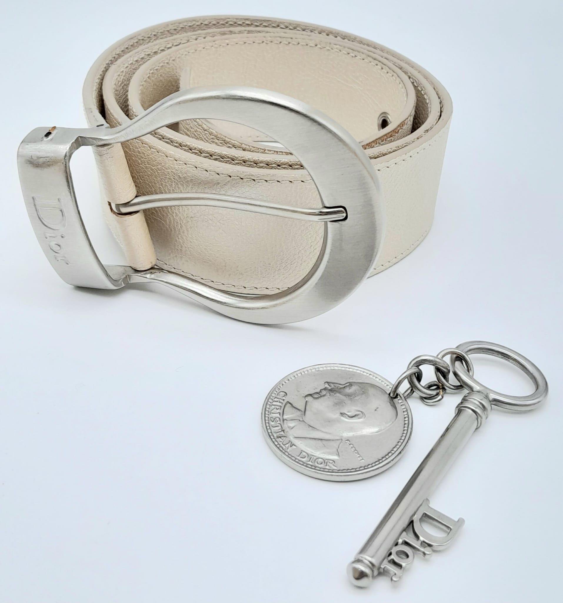Stylish Christian Dior Leather Belt. Made in Italy, this pearlescent ivory white CD belt measures