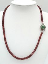 A 125ct Spessartite garnet Necklace with Emerald and 925 silver Clasp. 42cm.
