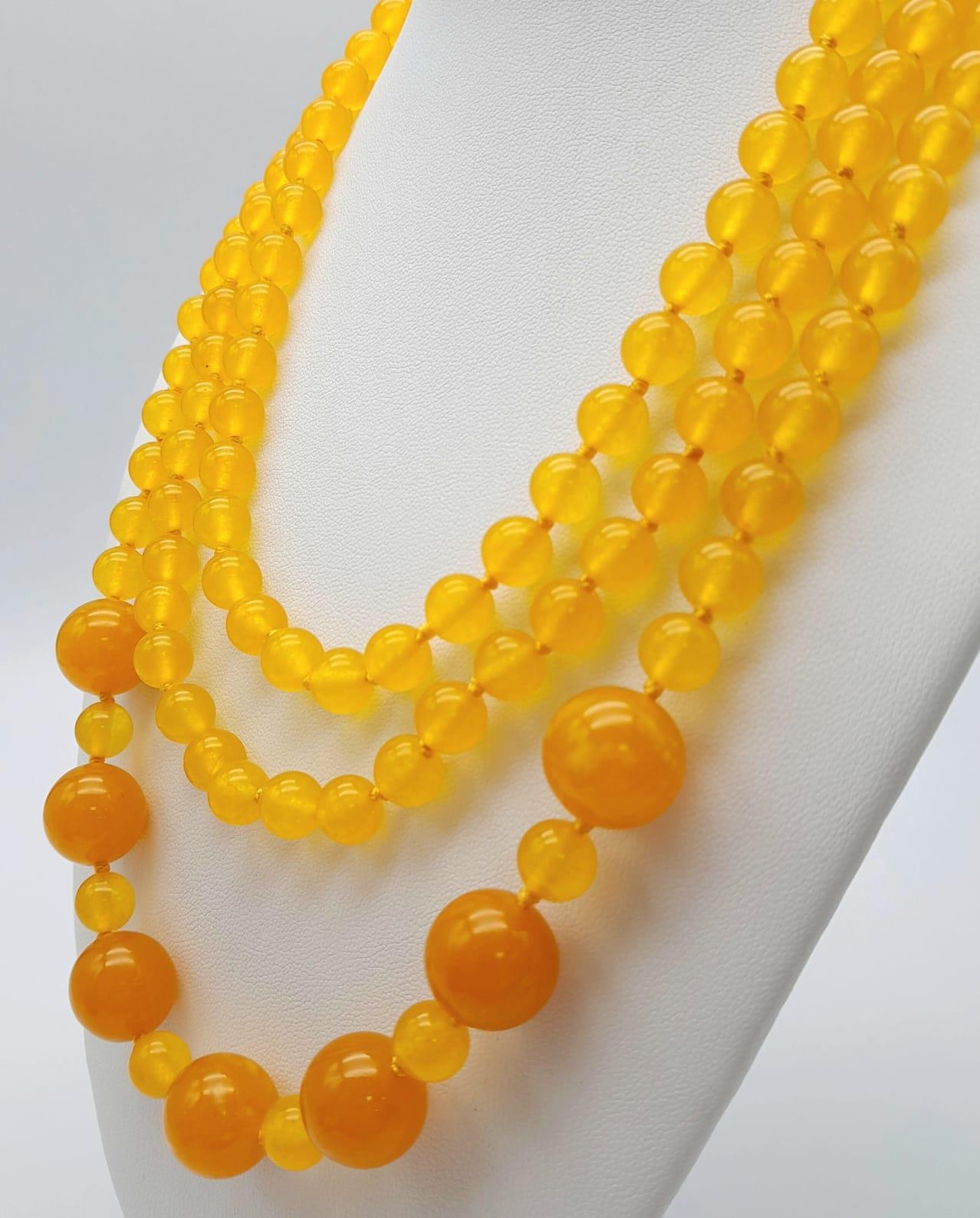 A Rope Length Yellow Jade Necklace with Different Sized Jade Beads - 8mm and 14mm. Necklace length - - Image 2 of 3