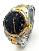 A Rolex Oysterdate Mid-Size Watch. Two tone bracelet and case - 31mm. Black dial. Automatic movement