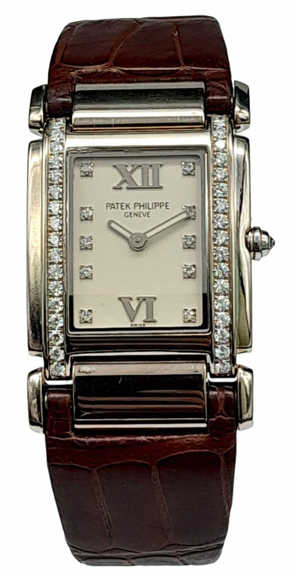 A Vintage Patek Philippe 18K White Gold and Diamond Ladies Watch. Brown leather strap with 18k