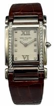 A Vintage Patek Philippe 18K White Gold and Diamond Ladies Watch. Brown leather strap with 18k