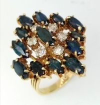An 18K Yellow Gold (tested) Diamond and Sapphire Dress Ring. Six brilliant round cut diamonds - 0.