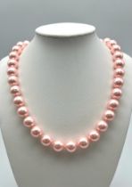 A Metallic Pink South Sea Pearl Shell Large Bead Necklace with a Heart Shape Clasp. Beads - 12mm.