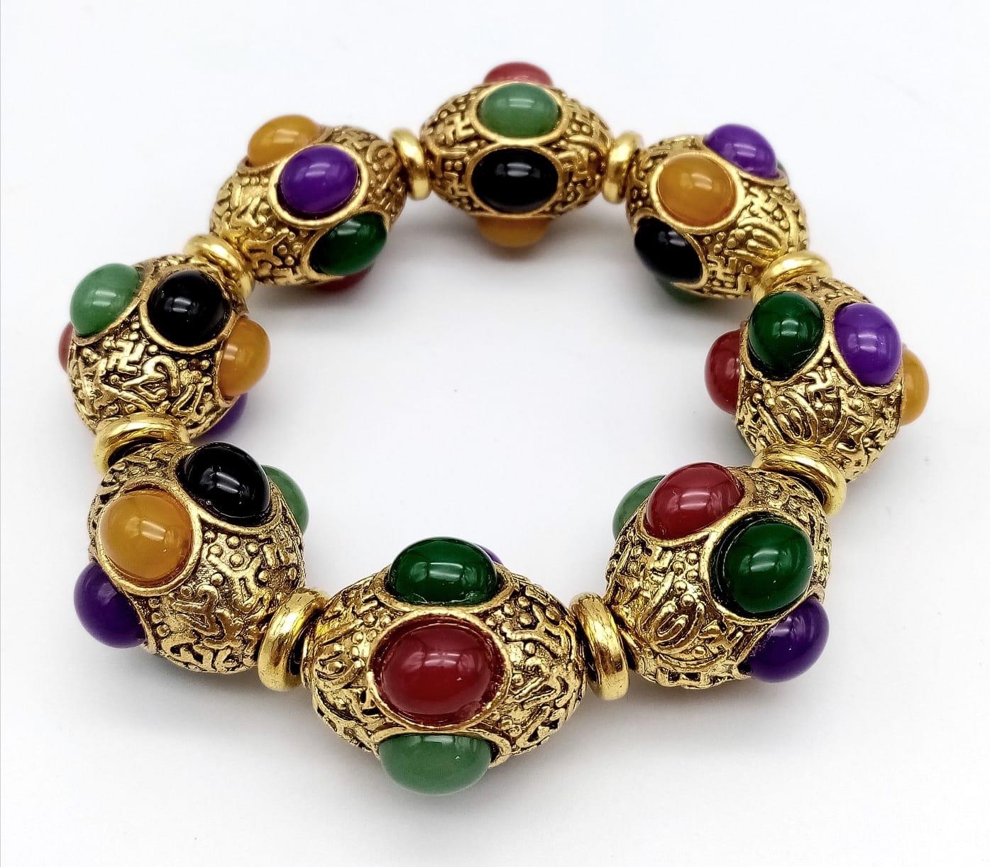 A Gilded Tibetan Style Bracelet with Multi-Colour Jade Cabochon Decoration. Gilded spacers.
