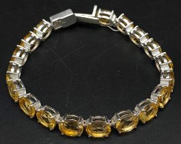A Citrine Gemstone Tennis Bracelet on 925 silver. 19.5cm in length, 20.73g total weight.