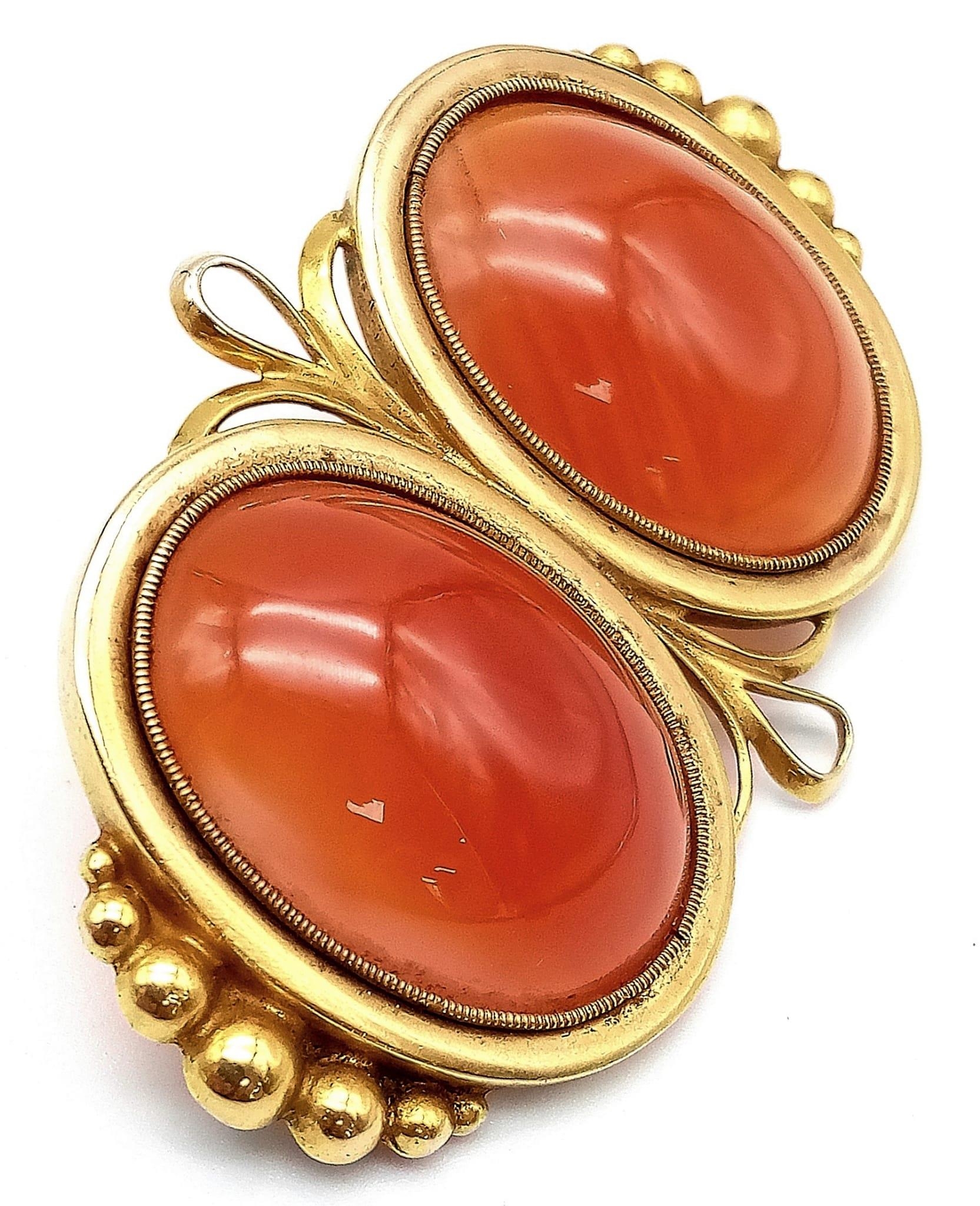 An Antique 18K Yellow Gold (tested) and Carnelian Brooch. Two rich orange cabochons of carnelian set - Image 2 of 4