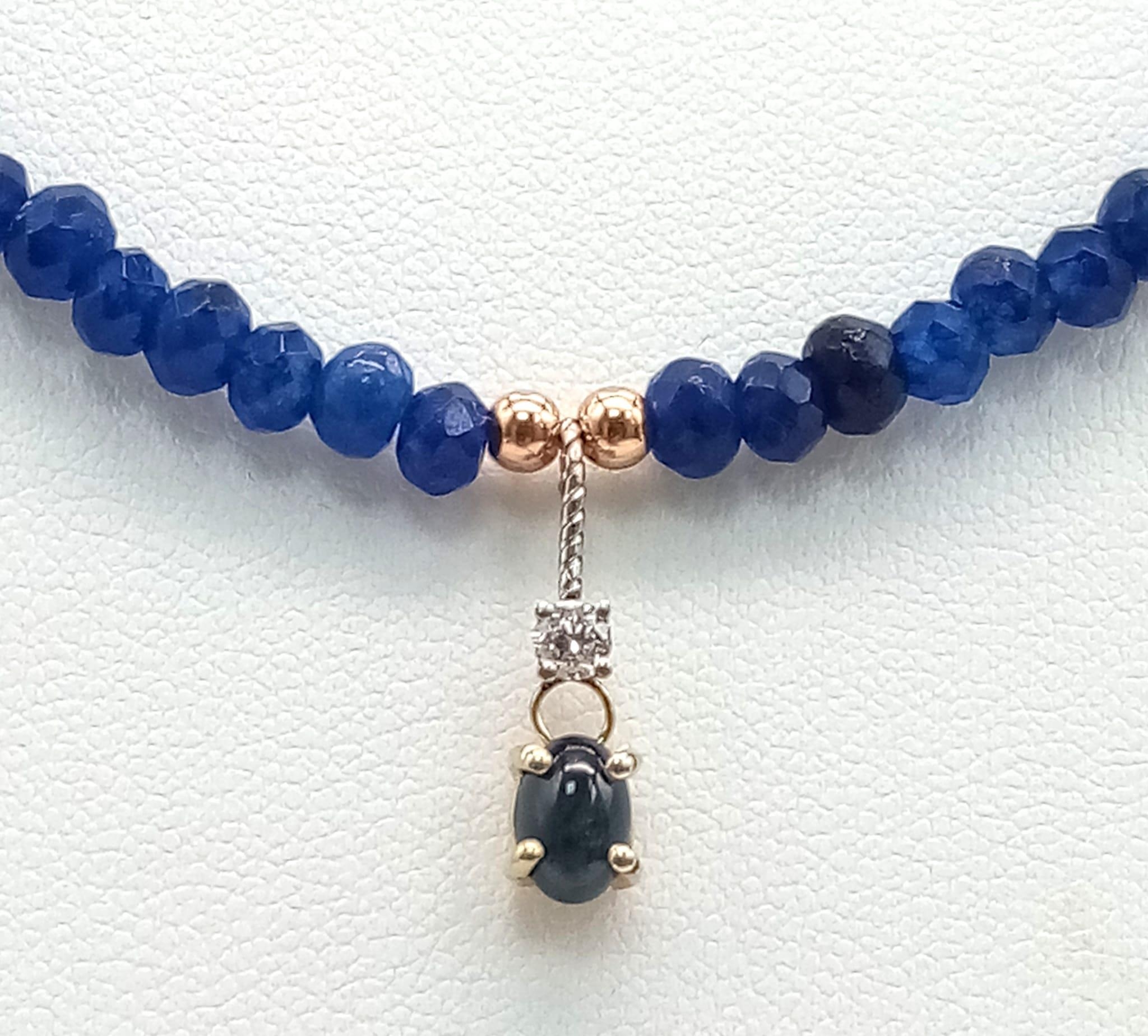 A Sapphire Small Bead Necklace with Diamond and Sapphire Hanging Decoration. 0.07ct diamond. 14k - Image 3 of 4