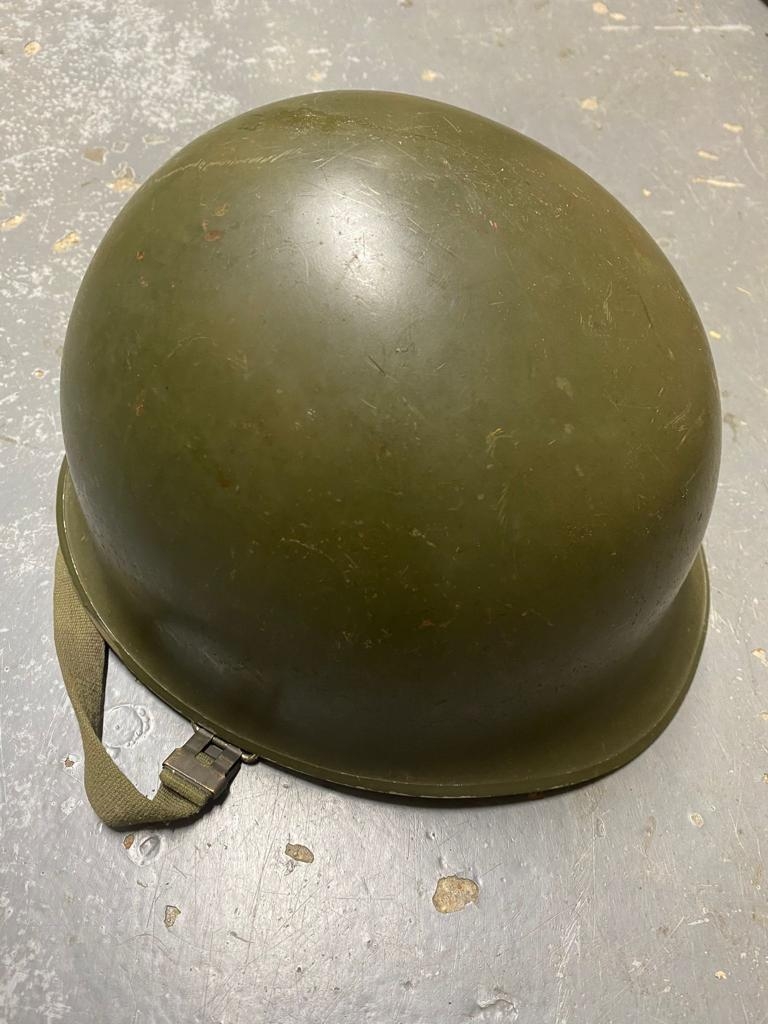 A USA Vietnam War Era M1 Helmet. The liner is dated 1967. The helmet is marked LS782. ML352