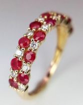 A 9K YELLOW GOLD DIAMOND & RUBY 2 ROW RING. Size M, 0.20ctw diamonds, 1.5g total weight.
