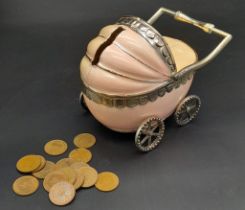 A vintage, baby pram moneybox with over hundred halfpenny coins (various dates) inside. These