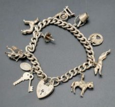 A wonderful, vintage, chain bracelet with 10 charms. Total weight: 44.5 g.