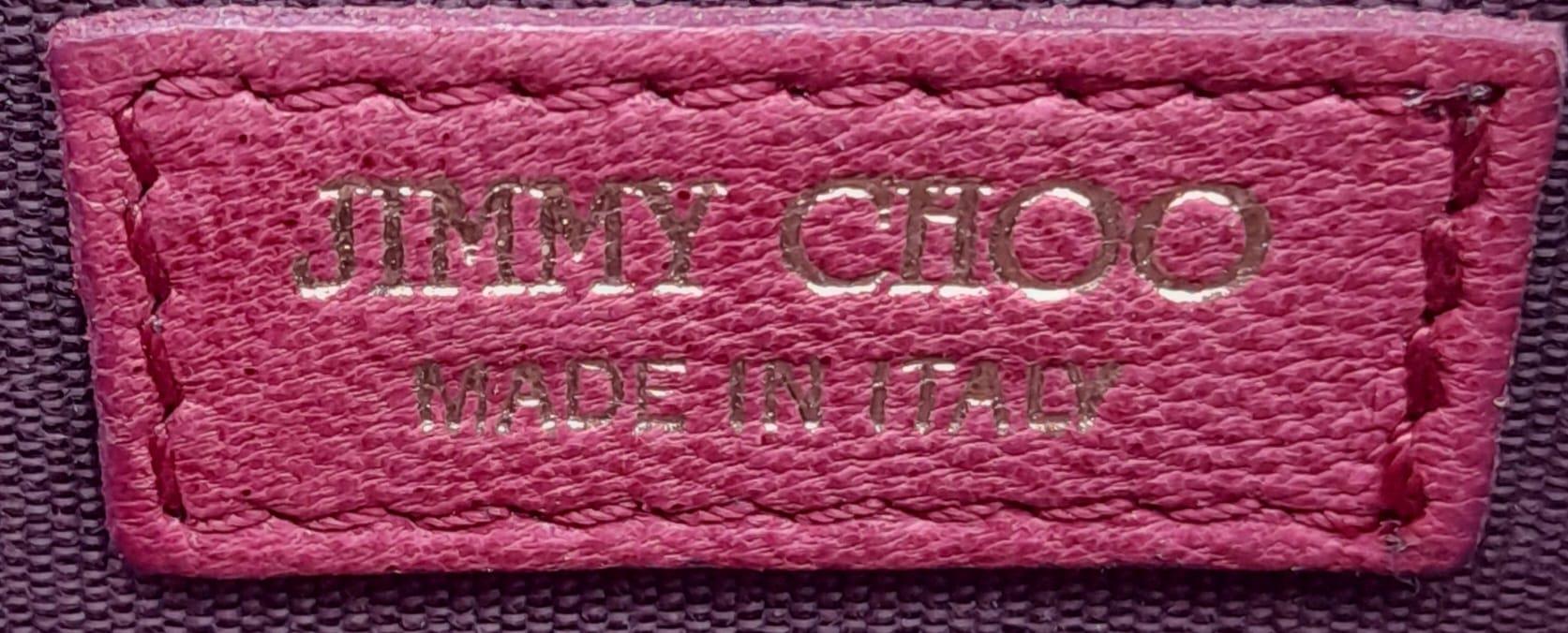 A Jimmy Choo Magenta Bag. Leather exterior with gold-tone hardware and chain strap. Canvas interior, - Image 6 of 11