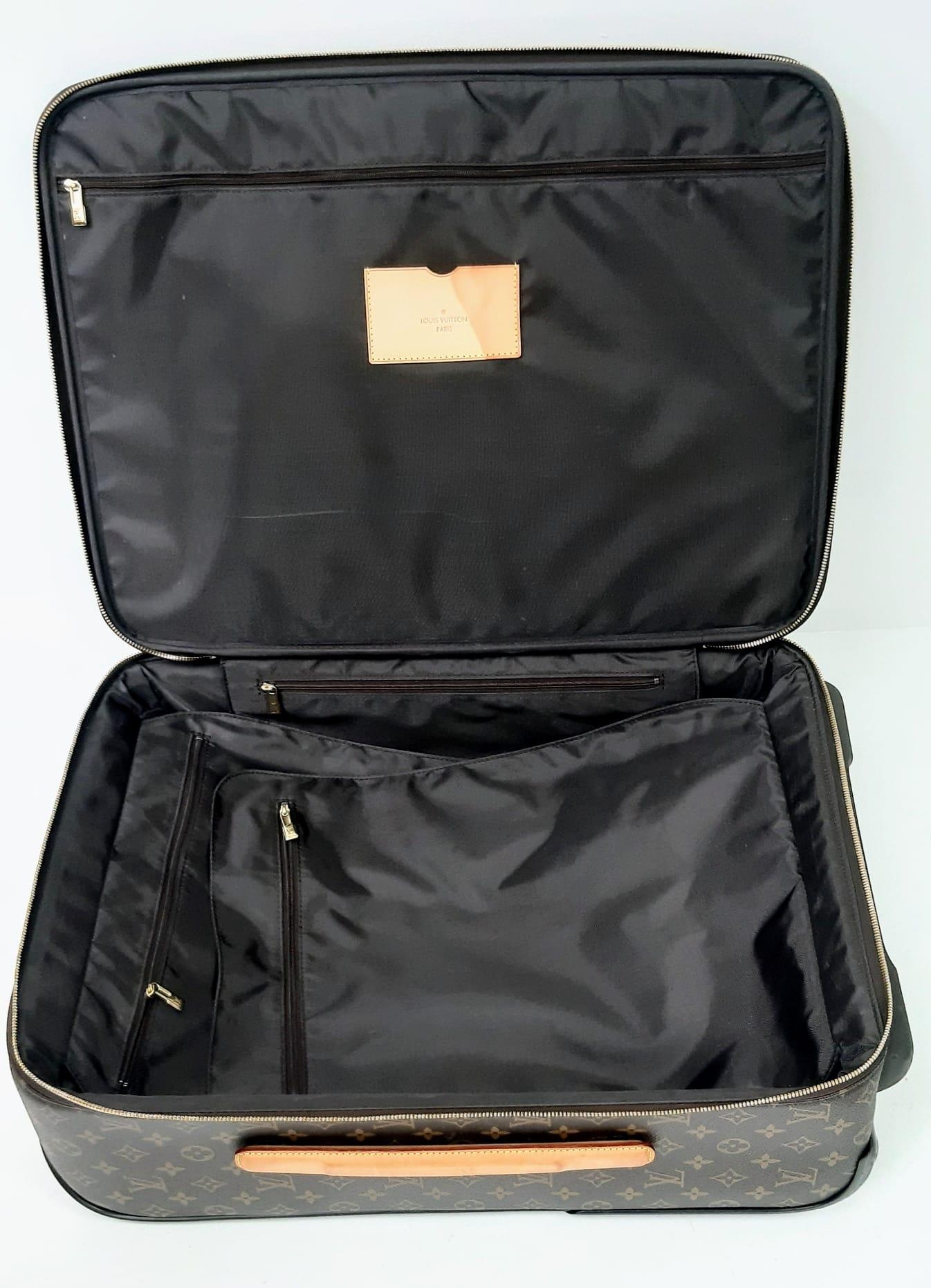 A Louis Vuitton Monogram Pegase Suitcase. Durable leather exterior. Front compartment with zipper, - Image 6 of 9