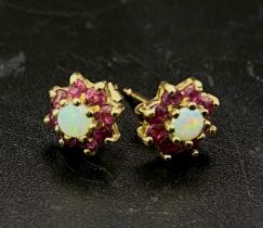 A Pair of 9K Yellow Gold Pink Topaz and Opal Stud Earrings. 1.05g total weight.