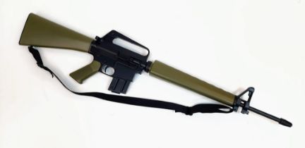 An M16 A1 Navy Factory-Deactivated Dry Fire Rifle. Dry fire, with a sling and carry case. Military
