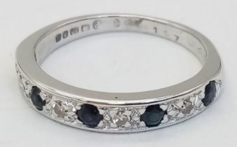 AN 18K WHITE GOLD DIAMOND & SAPPHIRE HALF ETERNITY RING. Size L/M, 3.2g total weight.