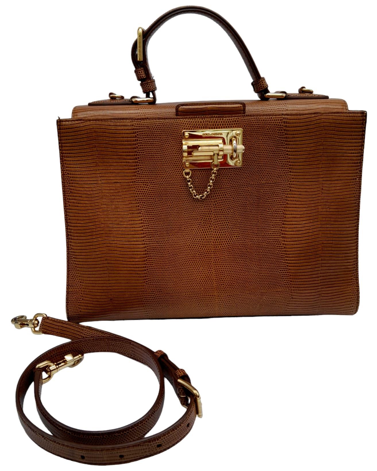 A Dolce & Gabbana Brown 'Monica' Bag. Lizard embossed leather exterior, with a single handle and