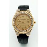 An Audermars Piguet 18K Gold and Diamond Ladies Watch. Black leather strap with 18k gold and diamond