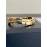 9 carat GOLD RING in attractive Serpentine form with single stone detail.1.92 grams. Size M.