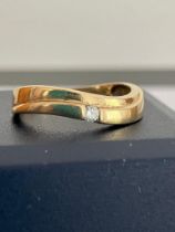 9 carat GOLD RING in attractive Serpentine form with single stone detail.1.92 grams. Size M.