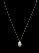 An 18K South Sea Teardrop Pearl Pendant on an 18K Yellow Gold Disappearing Necklace. 17mm and