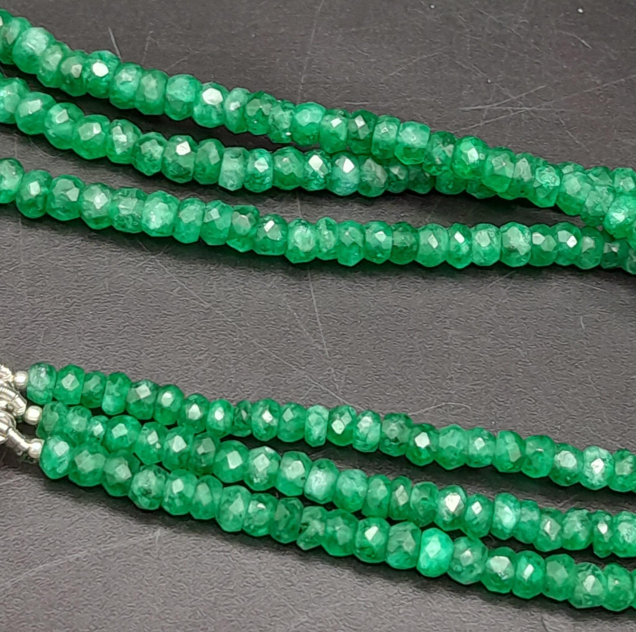 A Three Row Emerald Necklace with a Ruby and 925 Silver Clasp. 47.5cm in length, 250ctw emeralds, - Image 4 of 6