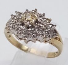 A 9K YELLOW GOLD DIAMOND CLUSTER RING IN THE FLORAL DECORATIVE SETTING 0.20CT 1.5G SIZE I