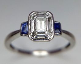 An 18K White Gold Diamond and Sapphire Ring. Size V. 3.45g total weight. 1.5ctw diamonds. Ref: