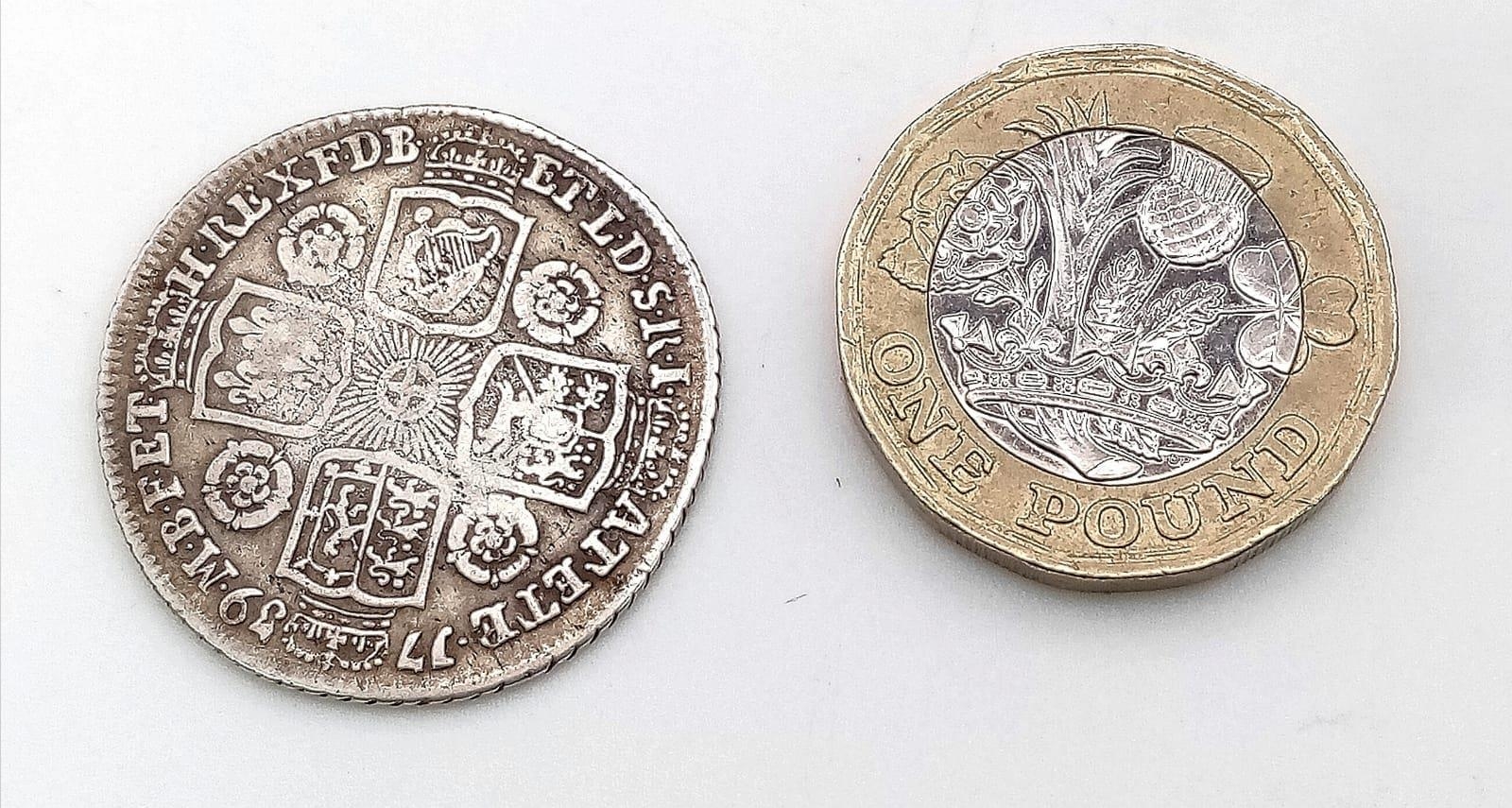 A 1739 George II Silver Shilling Coin. Roses in angles. Normal garter star at centre. S3701. - Image 2 of 2