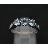 A 9K WHITE GOLD DIAMOND & BLUE TOPAZ RING 3.1G SIZE O