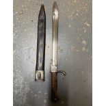 A WW1 German Saw-Back Bayonet - Makers mark of Erfurt. Comes with scabbard. ML347