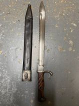A WW1 German Saw-Back Bayonet - Makers mark of Erfurt. Comes with scabbard. ML347