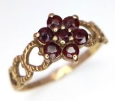 A vintage, 9 k yellow gold ring with a cluster of garnets, size: P, weight: 1.7 g.