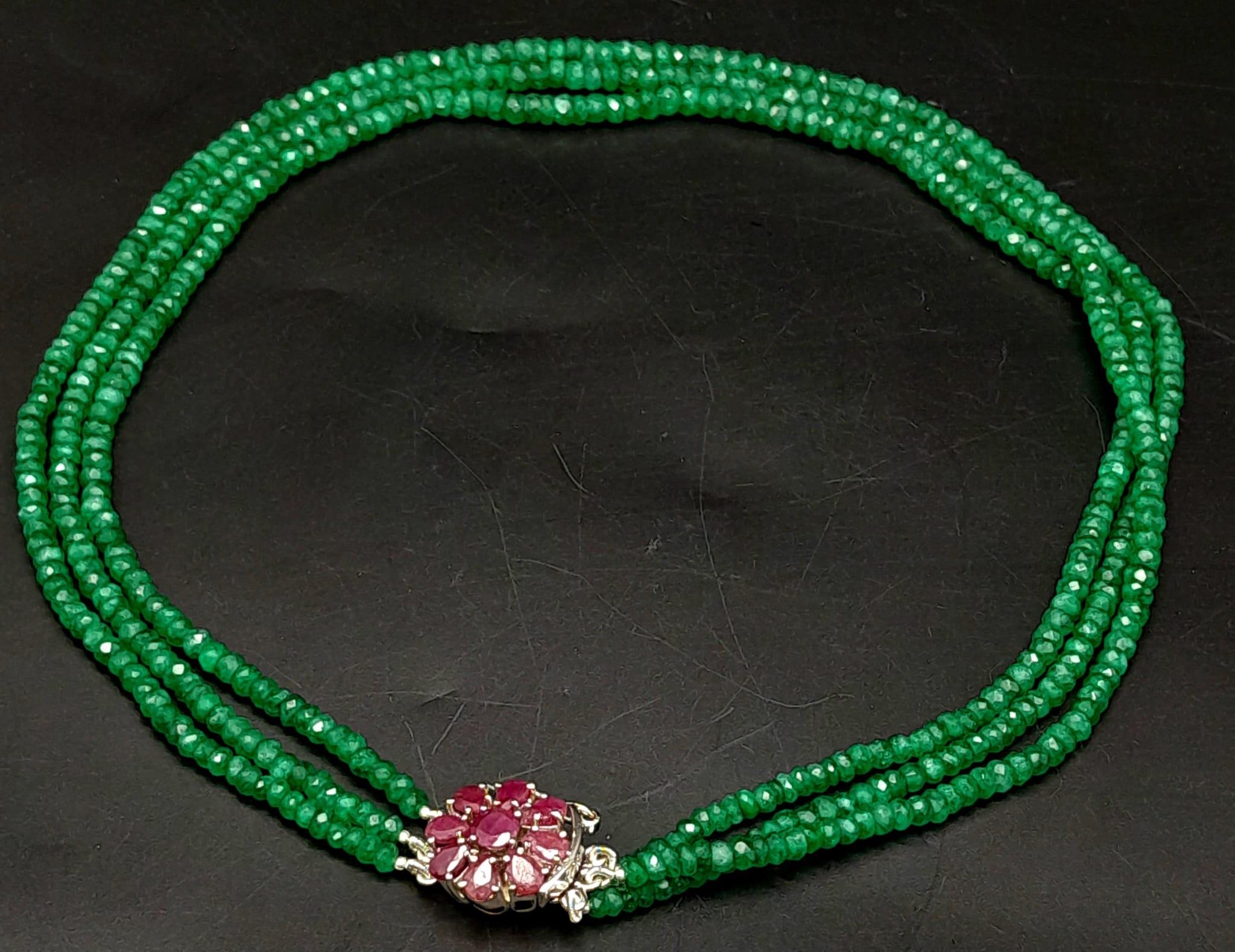 A Three Row Emerald Necklace with a Ruby and 925 Silver Clasp. 47.5cm in length, 250ctw emeralds, - Image 3 of 6